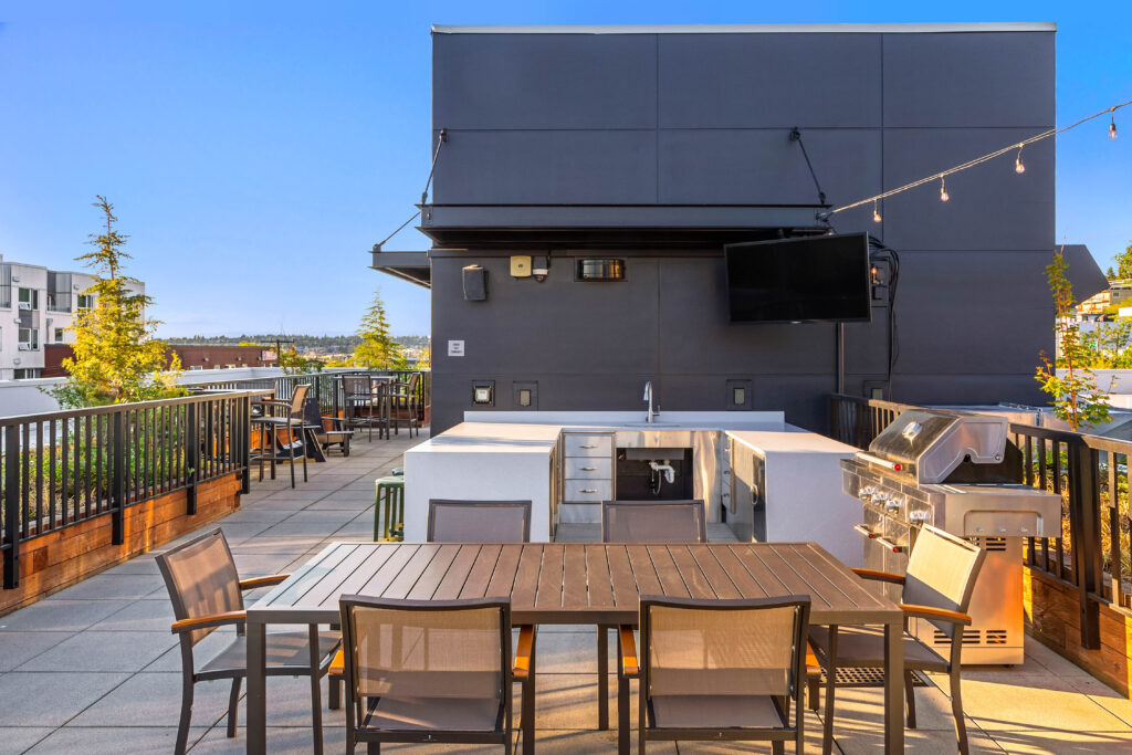 Exterior of Contour Apartments with Puget Sound in the background