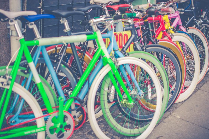Row of colorful bicycles in secure resident bike storage