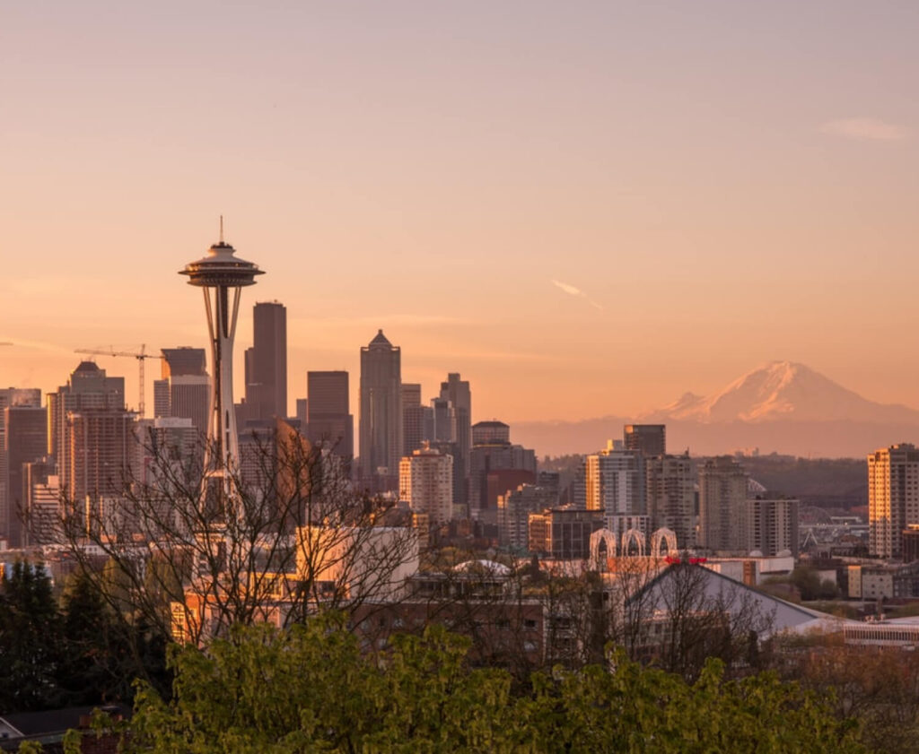 Seattle skyline at sunset with the Space Needle and Mount Rainier