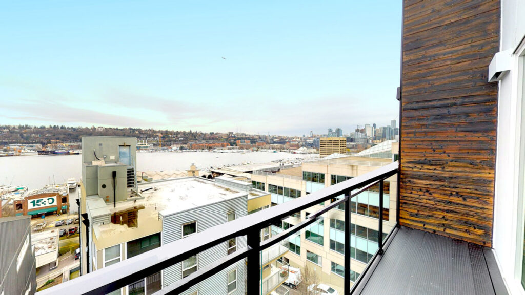 Private patio with seating at Contour Apartments in Interbay